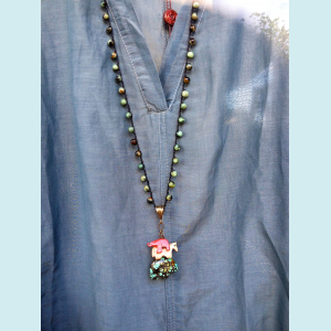Felicia- Crocheted necklace of turquoise beads and fetish dangles.